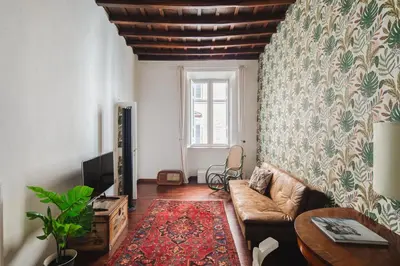 a living room with a couch and a window at Dadi Inn Monti in Rome