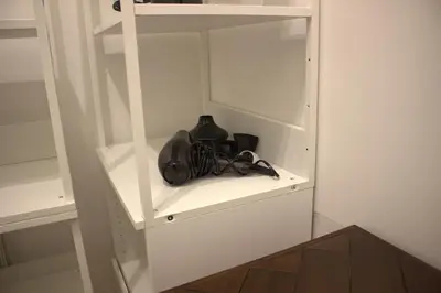 a purse sitting on a shelf in a closet at LPR Pantheon - Stylish Apartment at the Pantheon in Rome