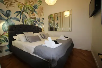 a bedroom with a bed with two towels on it at LPR Pantheon - Stylish Apartment at the Pantheon in Rome