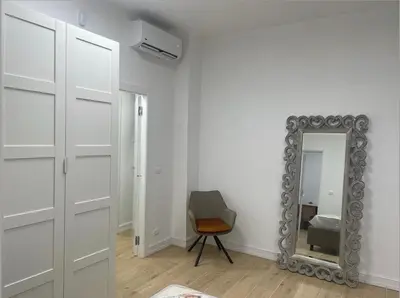 a room with a mirror and a chair and a mirror at Cola di Rienzo 243 Relais-A in Rome