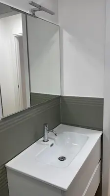 a bathroom with a white sink and a mirror at Cola di Rienzo 243 Relais-A in Rome