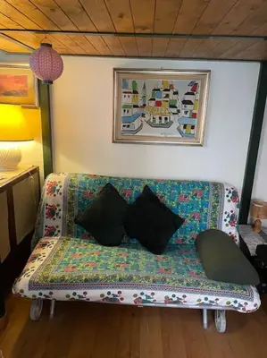 a couch with pillows on it in a room at Centro storico appartamento con terrazza in Rome