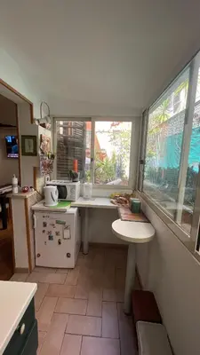 a kitchen with a table and a window in it at Centro storico appartamento con terrazza in Rome