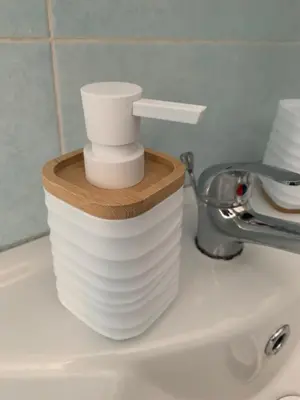 a stack of white dishes sitting on a sink at Home Carpiceci in Rome