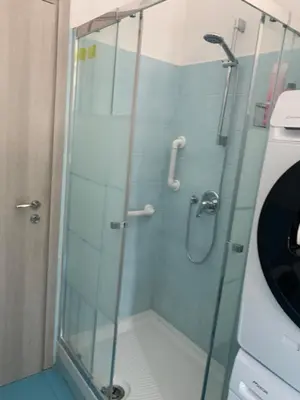 a shower with a glass door in a bathroom at Home Carpiceci in Rome