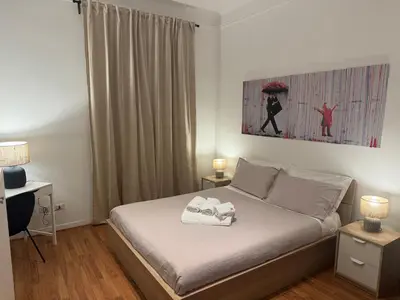 a bedroom with a bed with two towels on it at Be Your Home - Mazzini 144 in Rome