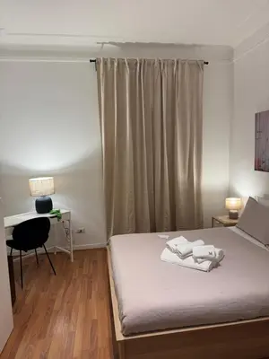 a bedroom with a bed with two towels on it at Be Your Home - Mazzini 144 in Rome