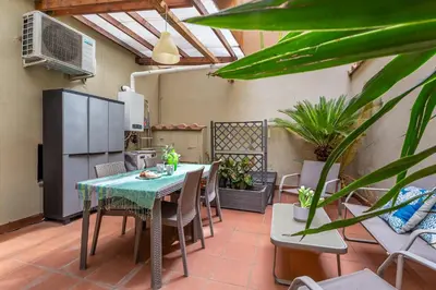 an outdoor patio with a table and chairs at iFlat Wonderful Home in Monti in Rome