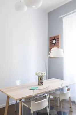 a dining room with a wooden table and chairs at Casa Esquilina in Rome