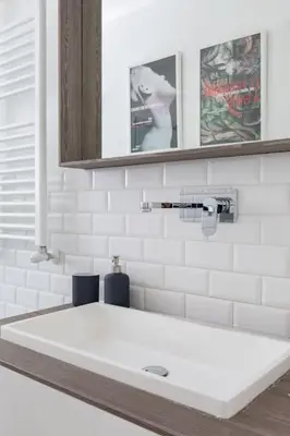 a bathroom with a white sink and a mirror at Casa Esquilina in Rome