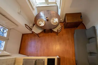 a table in the middle of a room at Piazza Navona - Tiny House in Rome