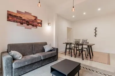 a living room with a couch and a table at Vatican Central Residence in Rome