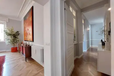 a hallway with white walls and a painting on the wall at LuxuryTerrace RomeApartment in Rome