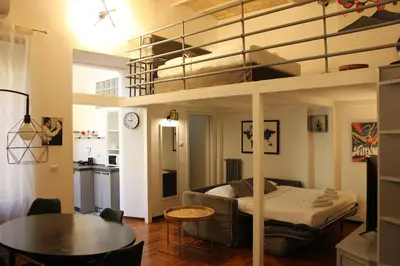 a living room with a loft bed and a kitchen at AD HOMES - Saint Peter Loft in Rome