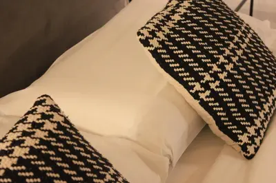 a black and white pillow and a black and white pillow at AD HOMES - Saint Peter Loft in Rome