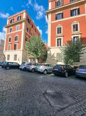 a group of cars parked in front of buildings at Grazioso appartamento ai Musei Vaticani in Rome