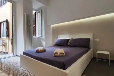 a bedroom with a bed with two towels on it at Cozy apartment near the Colosseum in Rome