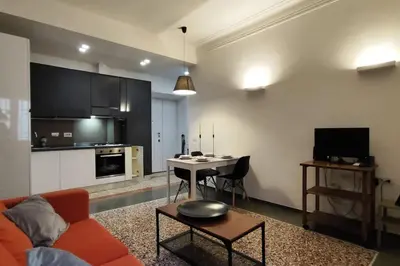 a living room with a couch and a table at Cozy apartment near the Colosseum in Rome