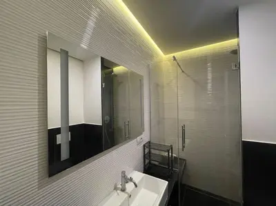 a bathroom with a sink and a mirror at Cozy apartment near the Colosseum in Rome