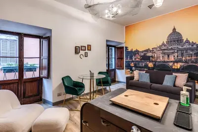 a living room with a couch and a table at Suite San Calisto Trastevere - by romanhouseit in Rome