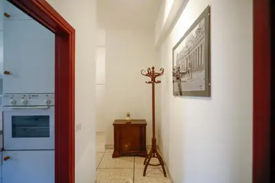 a hallway with a picture of a train on the wall at San Pietro Intero Alloggio -PANE&MELE- in Rome