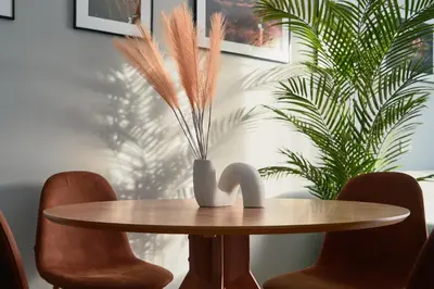 a wooden table with a vase on top of it at Basilica San Paolo - Home Cinema e Vasca Idromassaggio in Rome