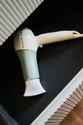 a hair dryer is hanging on a wall at Basilica San Paolo - Home Cinema e Vasca Idromassaggio in Rome