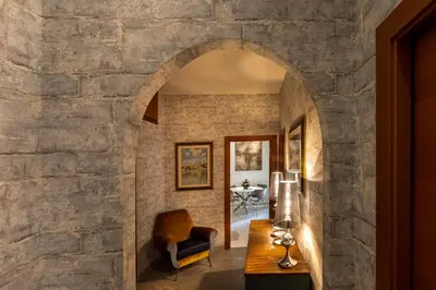 an archway in a room with a stone wall at Rome Elements Apartment in Rome