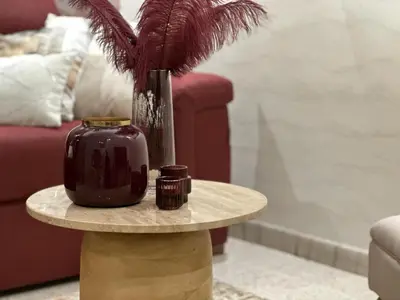 a table with a vase on top of it at Rome Elements Apartment in Rome