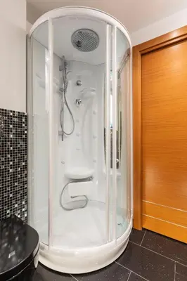 a shower with a glass enclosure in a bathroom at Rome Elements Apartment in Rome
