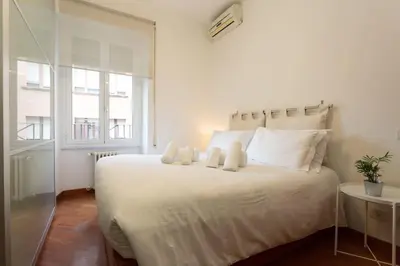 a bedroom with a large white bed with two pillows at Podesti House - Flaminio Stadio Olimpico in Rome