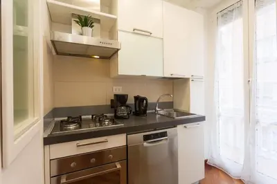 a kitchen with a sink and a stove top oven at Podesti House - Flaminio Stadio Olimpico in Rome