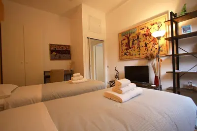 a hotel room with two beds with towels on them at Testaccio Holiday House in Rome