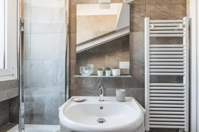a bathroom with a sink and a shower at The Best Rent - Apartment near Castel Sant'Angelo in Rome