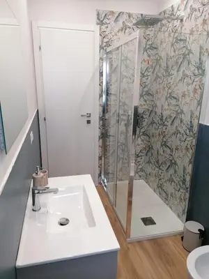 a bathroom with a shower and a sink at Capitale Bullicante in Rome