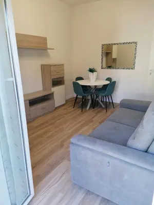 a living room with a couch and a table at Capitale Bullicante in Rome