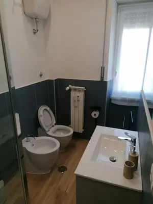 a bathroom with a toilet and a sink at Capitale Bullicante in Rome