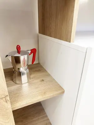 a mixer sitting on a shelf in a refrigerator at ZEUS GROUP VATICAN in Rome