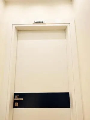 a sign that reads parioli above a door at ZEUS GROUP VATICAN in Rome