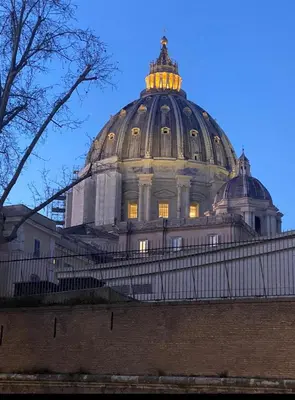 a building with a dome with lights on it at ZEUS GROUP VATICAN in Rome