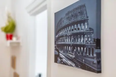 a picture of the louvre on a wall at The vatican garden in Rome