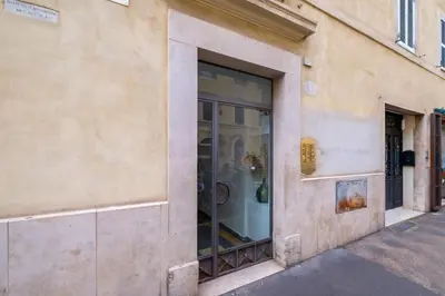a store front with a window on a street at ht bilo colosseo in Rome