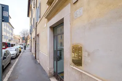 a building with a window on the side of a street at HT BILO 2 COLOSSEO in Rome