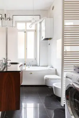 a bathroom with a tub and a toilet and a sink at La corte di Merlino - Apt centrale di pregio in Rome