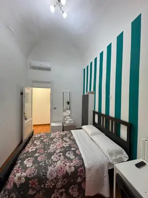 a bedroom with a large bed in a room at TERMINI STAR in Rome