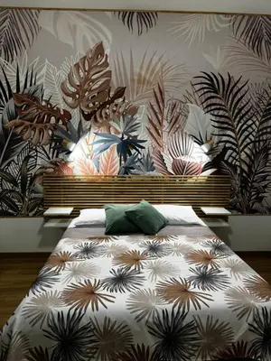 a bedroom with a bed with a floral wallpaper at San Paolo Casa Bella in Rome