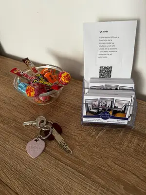a table with a box and a pair of keys at San Paolo Casa Bella in Rome
