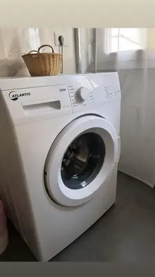 a washing machine with a basket on top of it at San Paolo Casa Bella in Rome