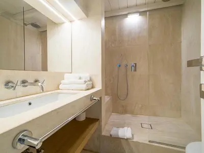 a bathroom with a tub and a shower with a sink at LUXURY Terrazza Privata su Fontana di Trevi in Rome