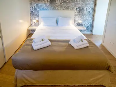 a bedroom with a large bed with towels on it at LUXURY Terrazza Privata su Fontana di Trevi in Rome